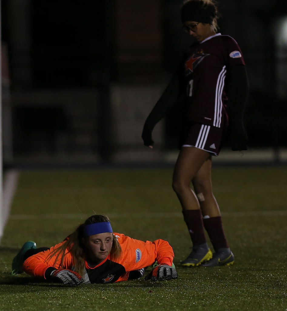 Kaylee Swinford lies on the ground